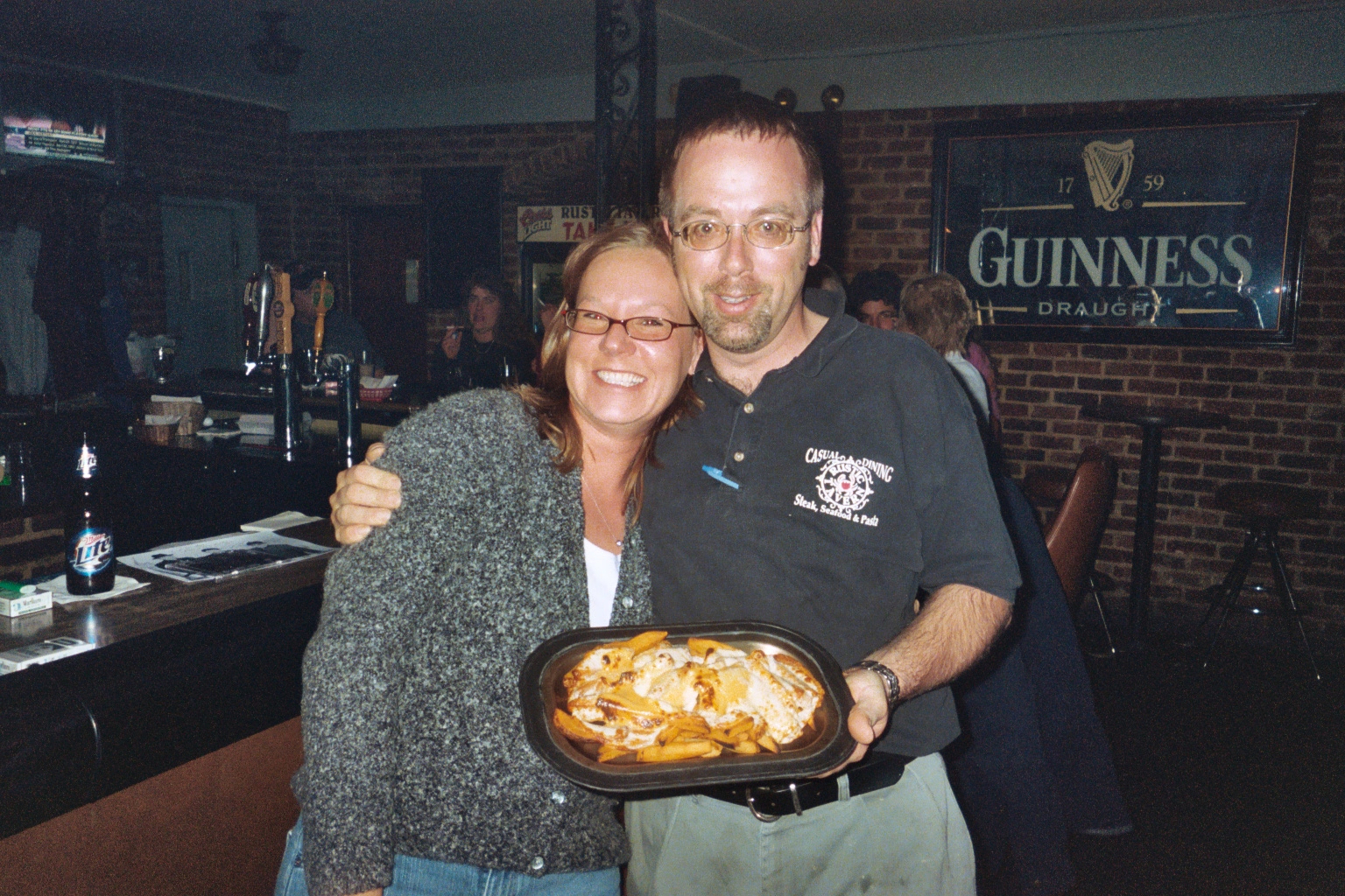 The Rustic Tavern
Bartender Jerry and new fan Lisa pose with some mouth watering fries...the music was hot too
