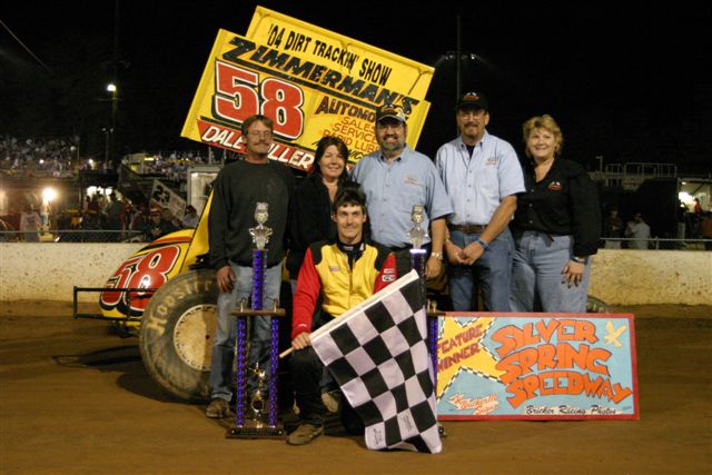 Paul Miller with team and sponsors in victory lane.
